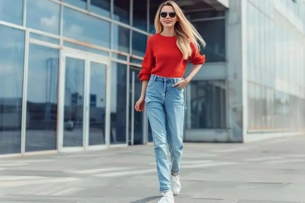 Here's an SEO-based alternative text for the image: Vervet Jeans style featuring a woman in high-waisted skinny jeans paired with a white t-shirt and red heels.