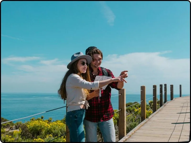 Couple enjoying a scenic outdoor walk, with the woman wearing stylish bootcut jeans, combining casual comfort and fashion for a versatile, laid-back look