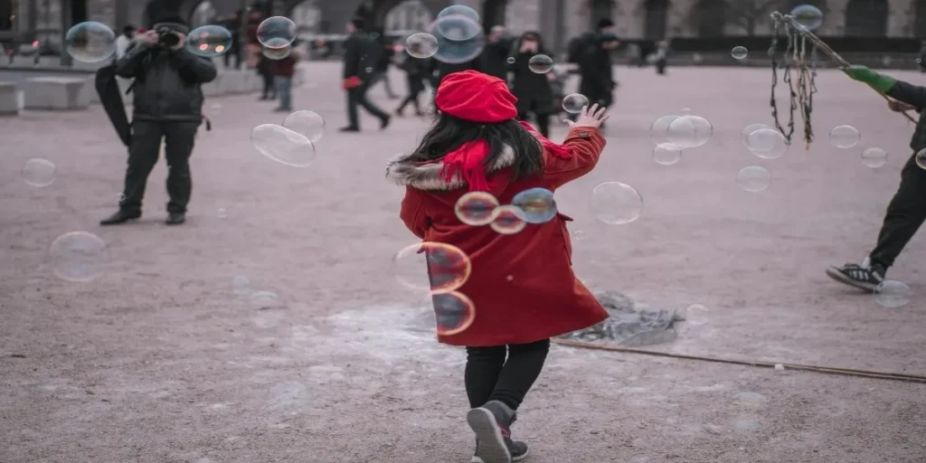 Seasonal fashion showcasing a red hoodie paired with jeans, highlighting stylish outfits suitable for different weather conditions and trends