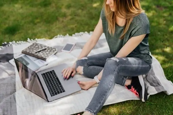 "Monochrome black outfit featuring high-rise jeans, showcasing a chic and cohesive black-on-black style."