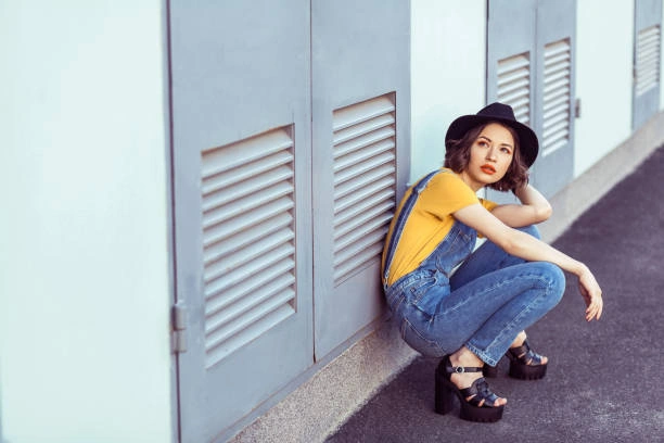 Woman showcasing styling tips for light Vervet jeans, demonstrating various outfit combinations and accessories for a fashionable look.