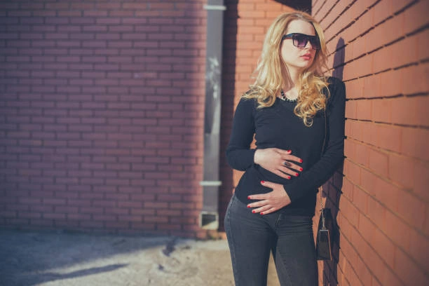 Stylish woman in black denim jeans paired with a casual top, showcasing a versatile everyday essential for any wardrobe.